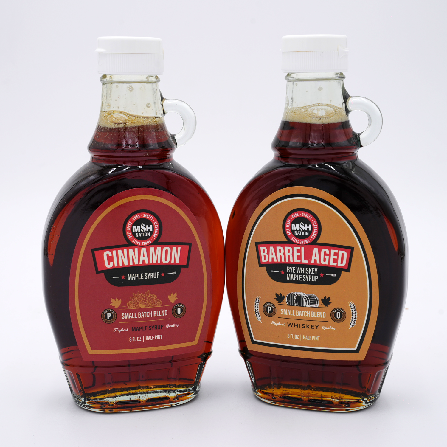 MSH Nation Cinnamon Maple Syrup and Barrel Aged Rye Whiskey Maple Syrup bottles side by side